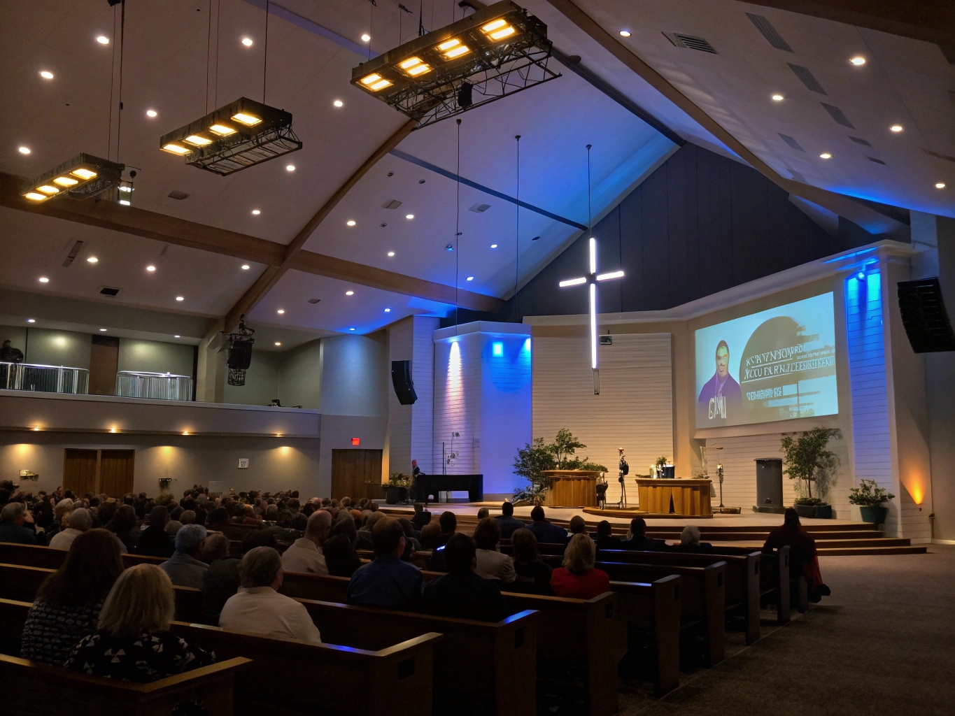 a split-screen image showing an engaged in-person congregation on one side and a professional online livestream of the same service on the other
