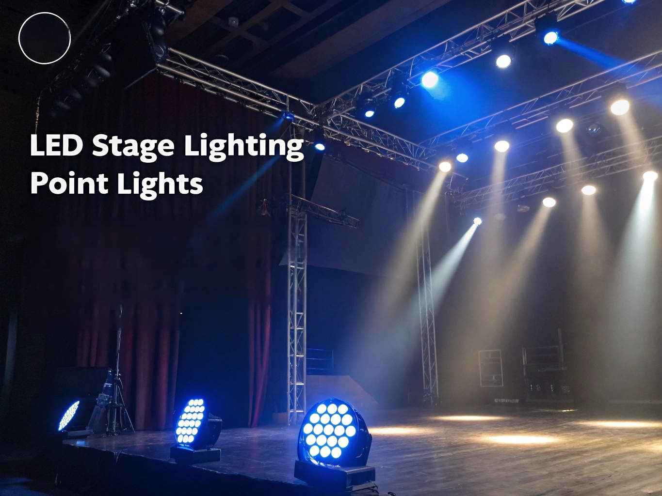 An empty stage powerfully lit with a combination of spot, wash, and moving lights.