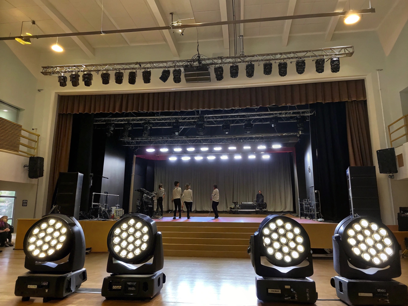 A side-by-side comparison of a rugged black LED PAR can and a white LED Profile spot light.
