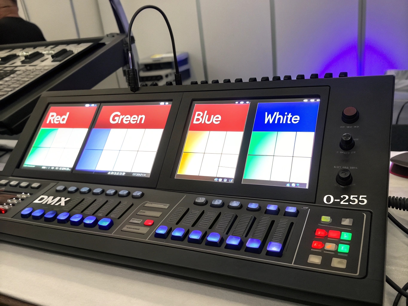 The screen of a lighting console showing faders for Red, Green, Blue, and White channels.